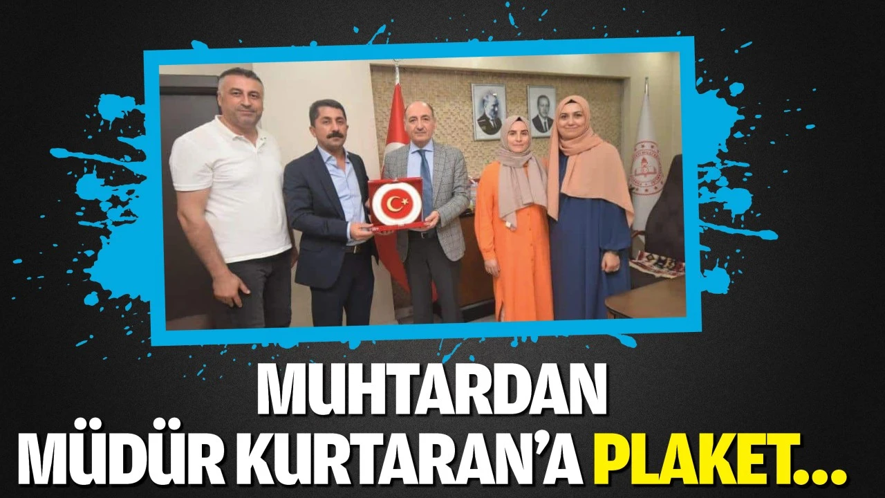 Muhtardan Müdür Kurtaran’a plaket…